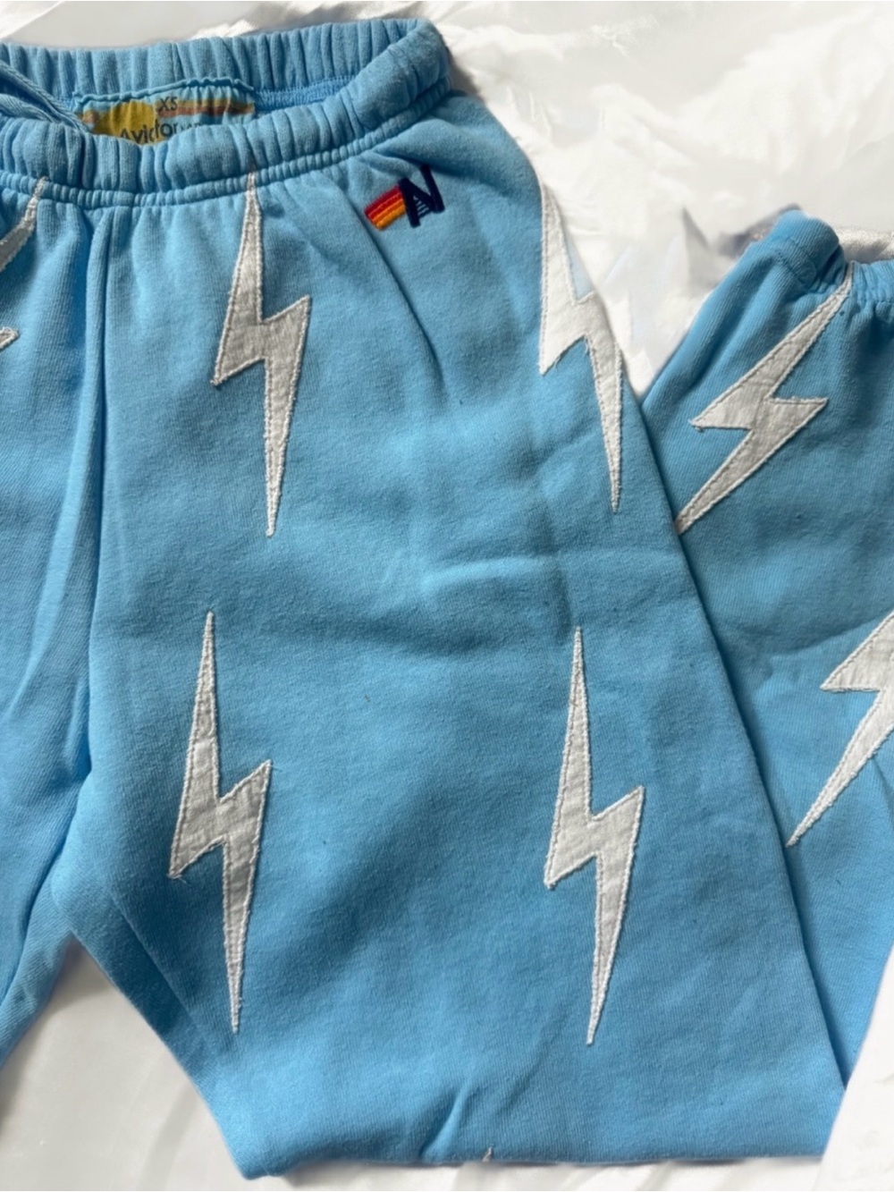 Women’s Aviator Nation Blue Sweatpants with white Lightning Bolts